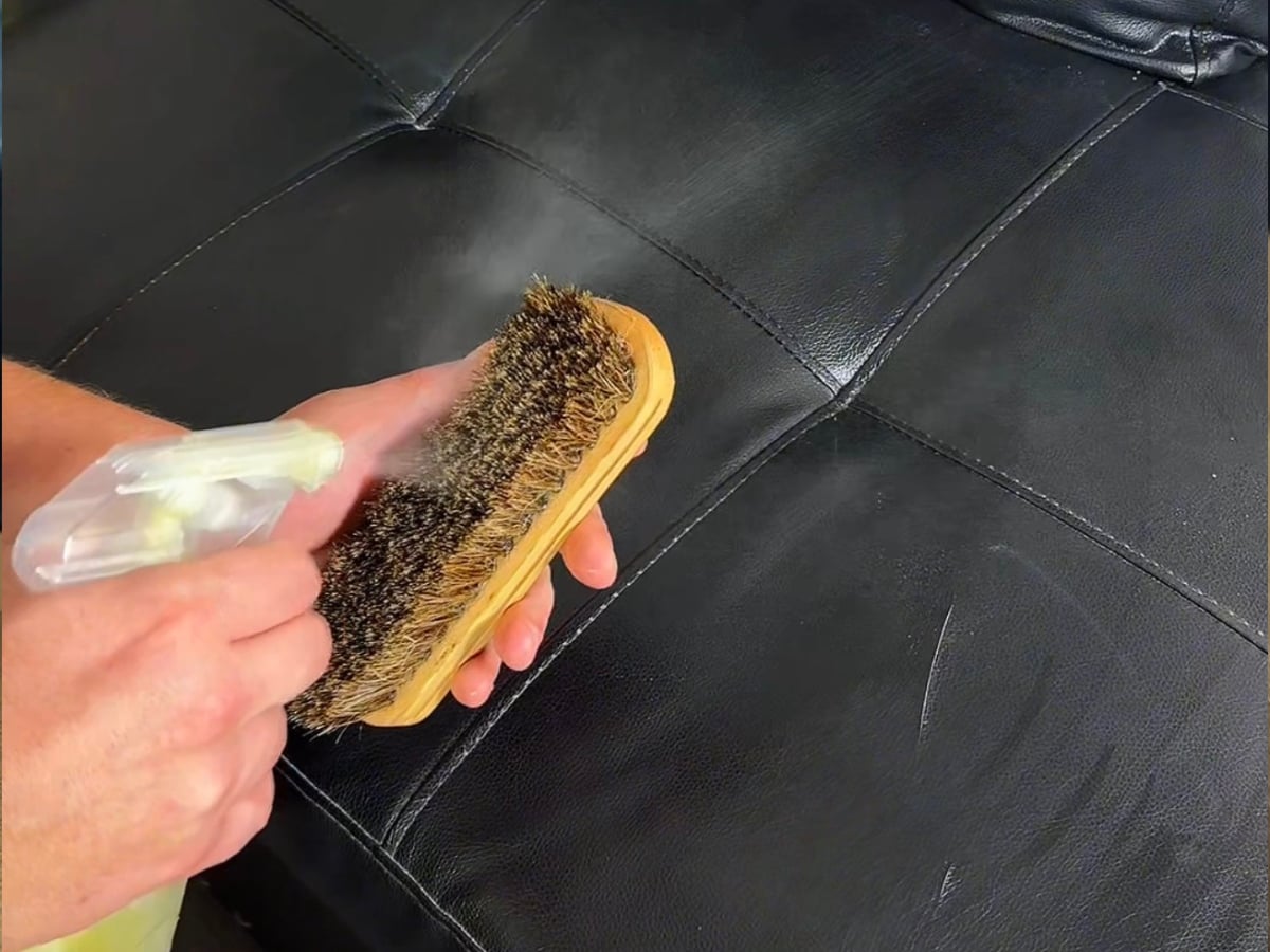 Aclean Steamers technician performing professional leather cleaning in a Charlotte, NC home