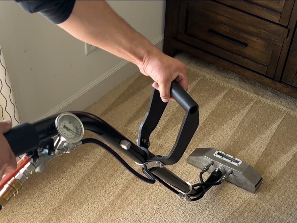 Aclean Steamers technician performing professional carpet cleaning in a Raleigh, NC home