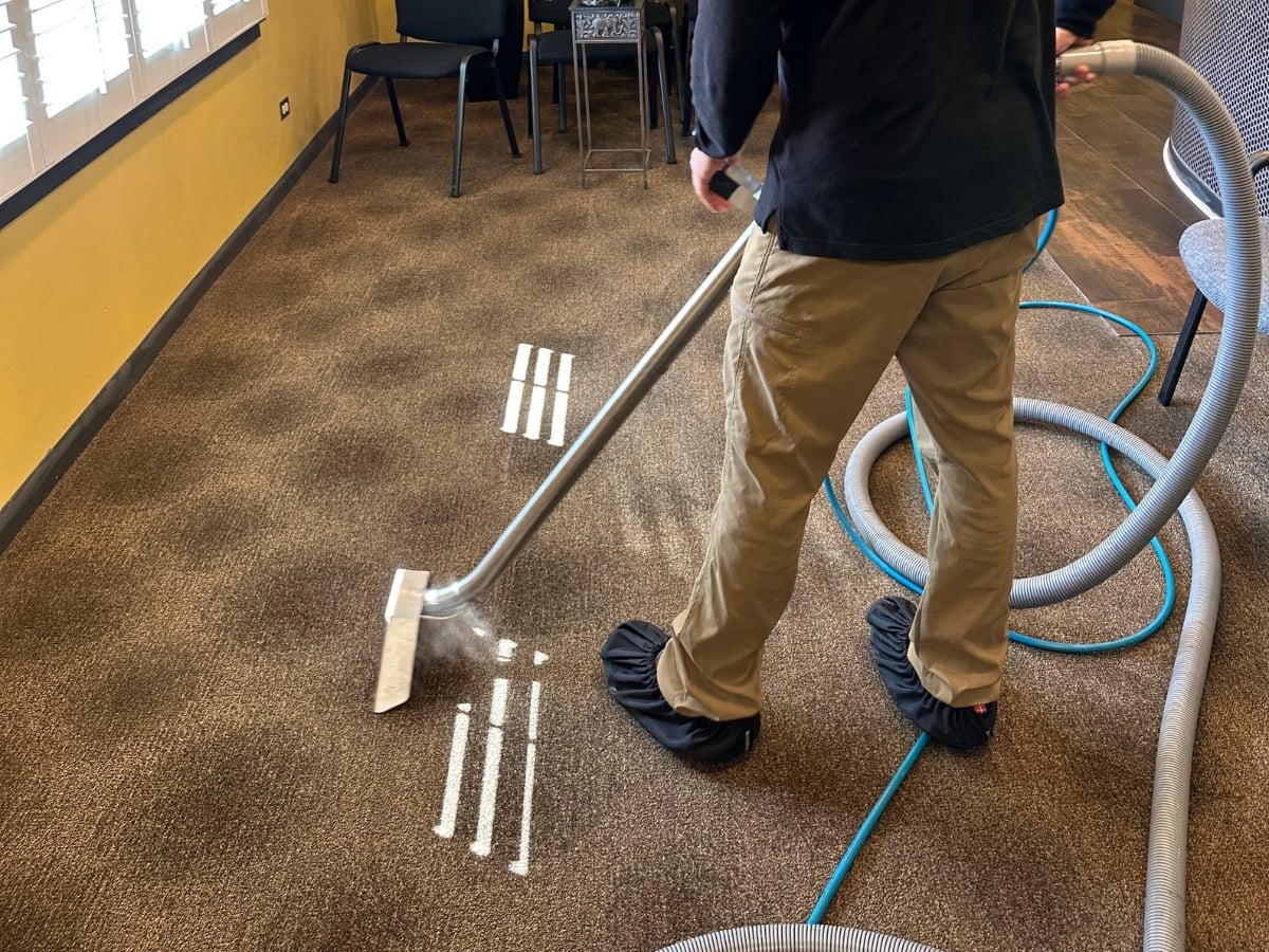 Aclean Steamers technician performing professional commercial cleaning in a Raleigh, NC business