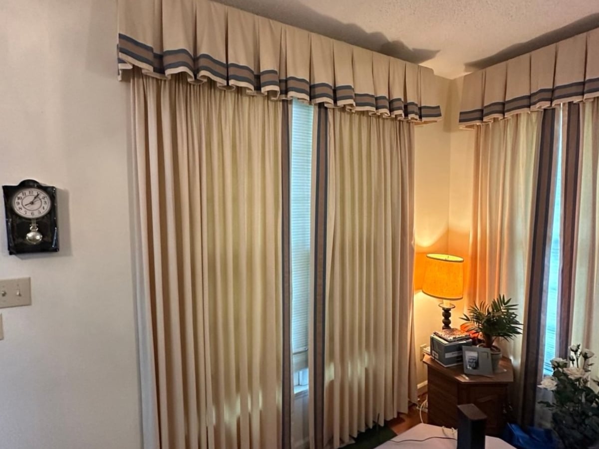 Aclean Steamers technician performing professional curtain cleaning in a Raleigh, NC home