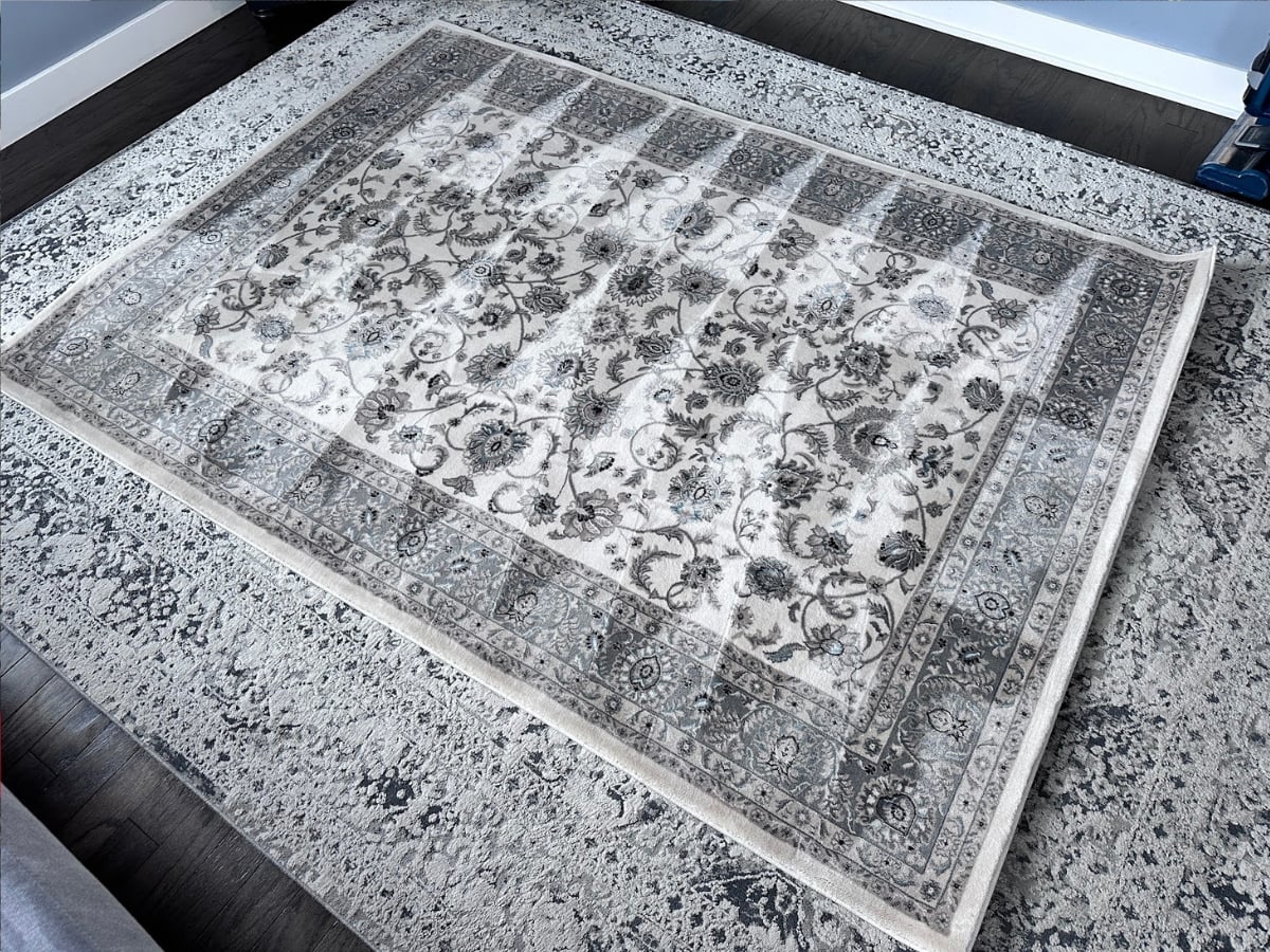 Aclean Steamers technician performing professional rug cleaning in a Raleigh, NC home