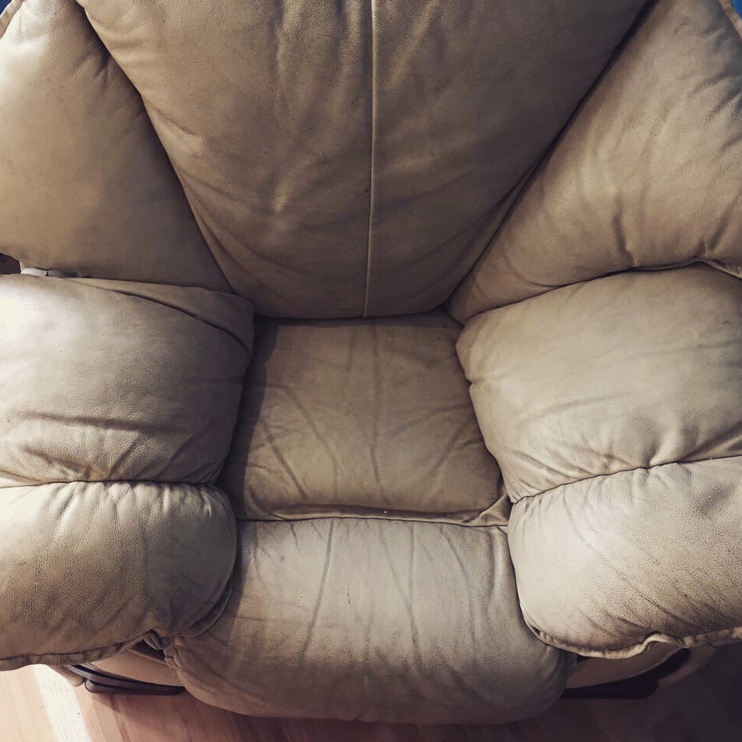 Dry, cracked leather sectional in Charlotte before Aclean Steamers treatment
