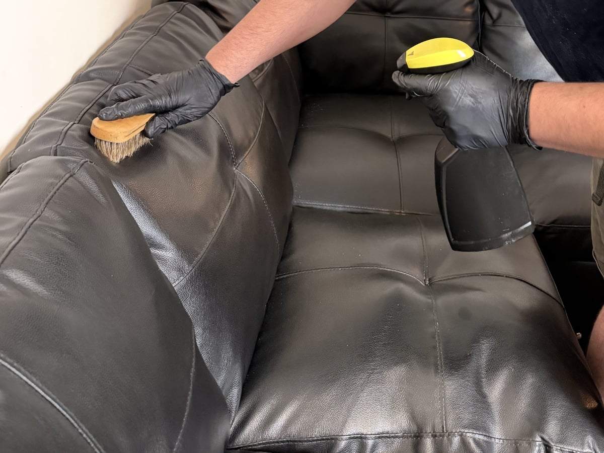Leather cleaning in a Charlotte, NC home, leather sectional restored to original sheen